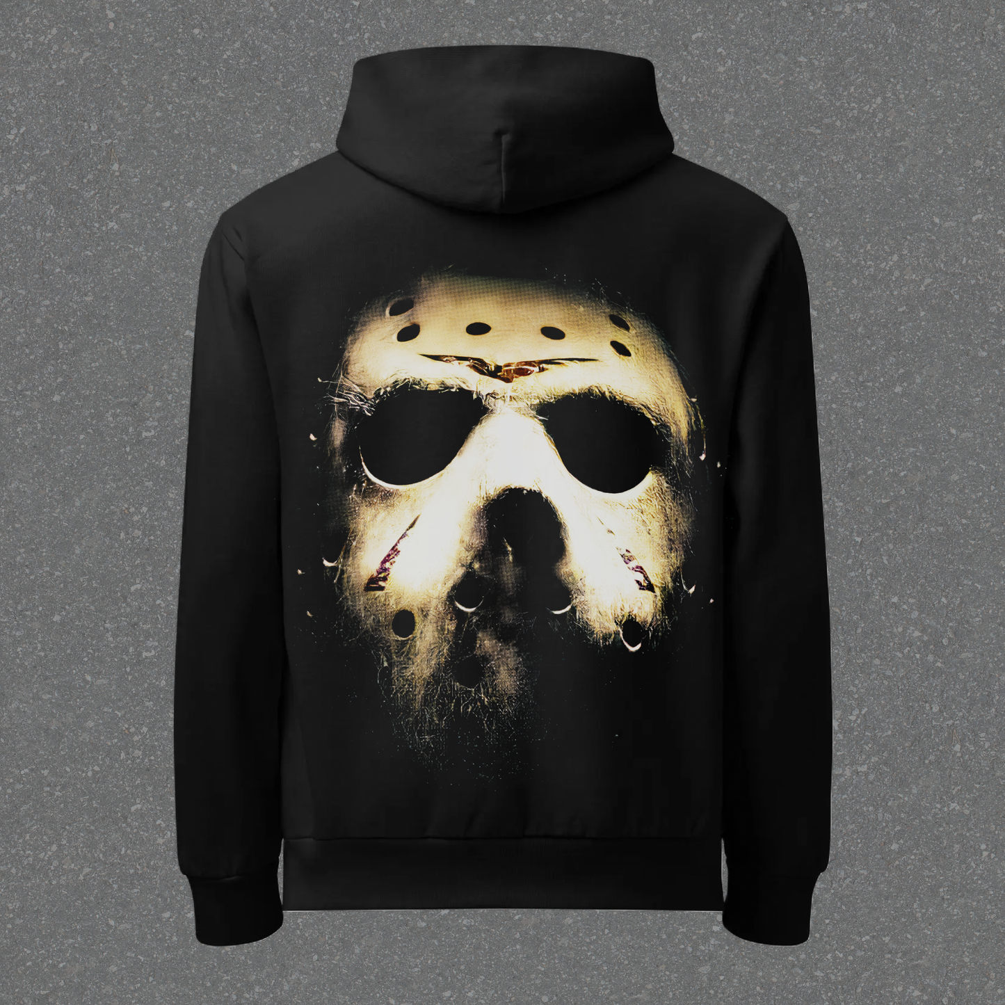 Black hoodie with a graphic of a mask on the back against a gray background