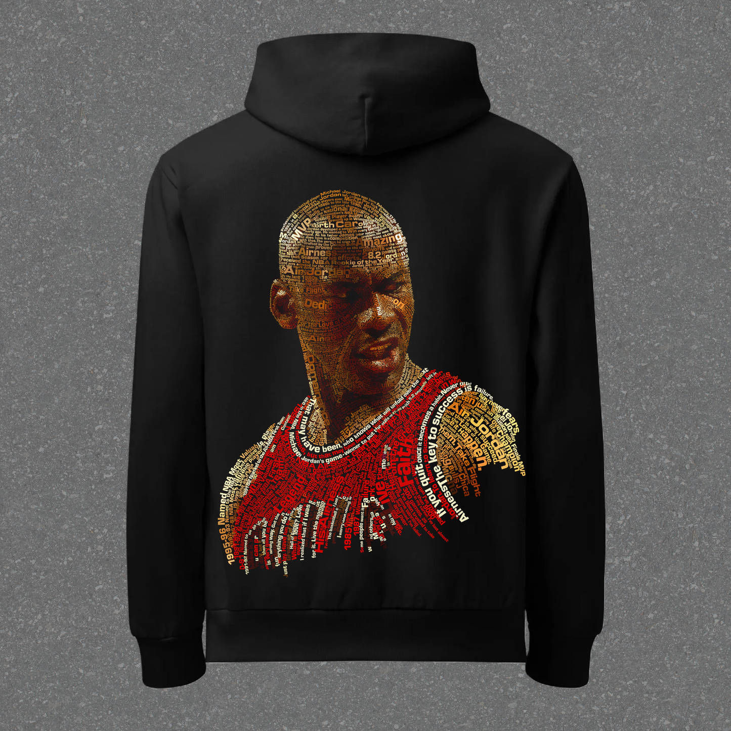 Black hoodie with a graphic design on the back against a gray background