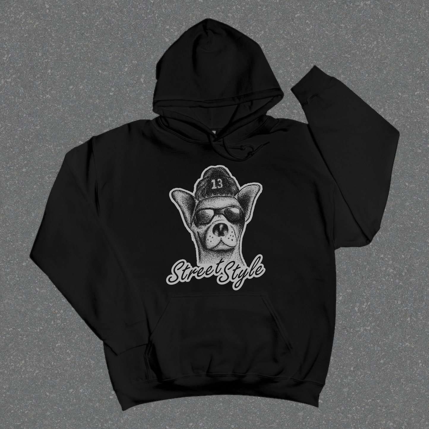 Black hoodie with a graphic design on a gray background
