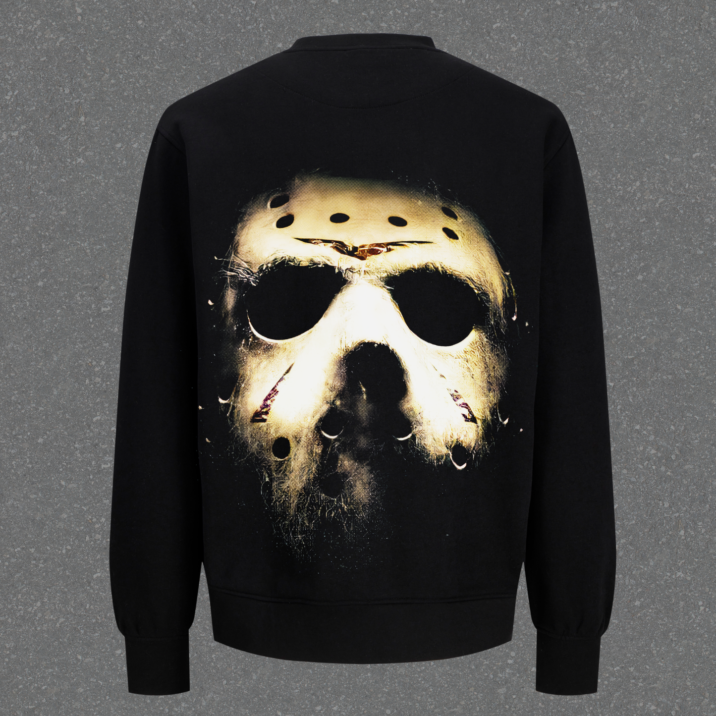Black sweatshirt with a graphic of a hockey mask on the back against a gray background