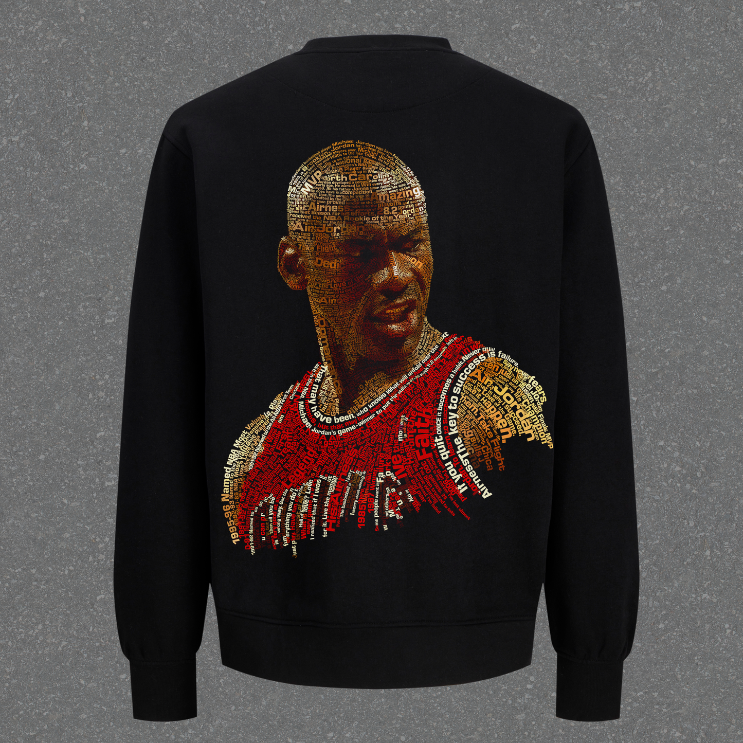 Black sweatshirt with a graphic design on the back against a gray background